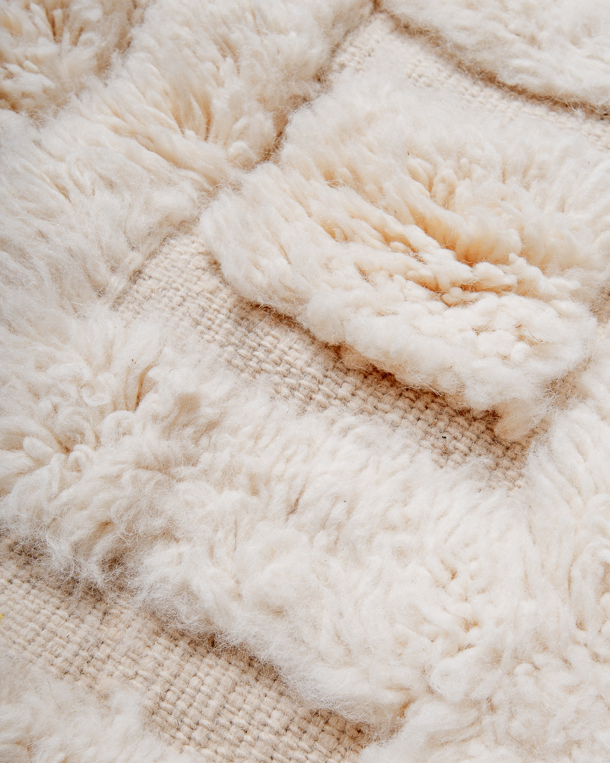 Modern, designer, handcrafted Berber rug from Morocco. Beniourain carpet with minimalist design, natural wool pile and a fluffy texture.